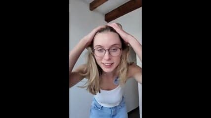 PALE WHITE SKINNY BLONDE TEEN WEARING GLASSES STRIP NAKED EXPOSING AND WIGGLING HER BIG NATURAL SAGGY TITS, TALKING DIRTY WHILE SHE FINGER FUCKS HER HOLES